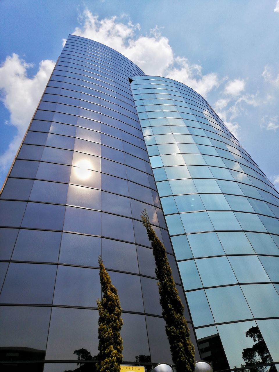 sky, low angle view, built structure, architecture, cloud - sky, building exterior, building, city, office building exterior, modern, office, nature, glass - material, no people, reflection, sunlight, day, tall - high, tower, outdoors, skyscraper, glass