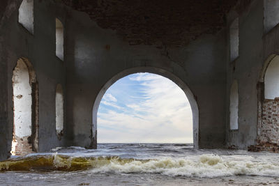 The ruins of an ancient temple, washed by water.