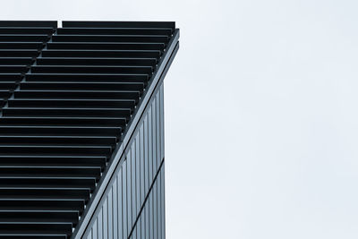 Low angle view of office building against sky