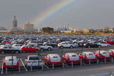 View of rainbow over road in city