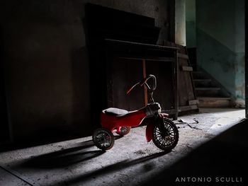 Toy car on wall of house