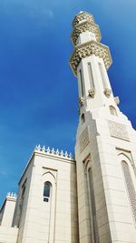 Low angle view of building against blue sky