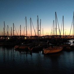 Boats moored at harbor