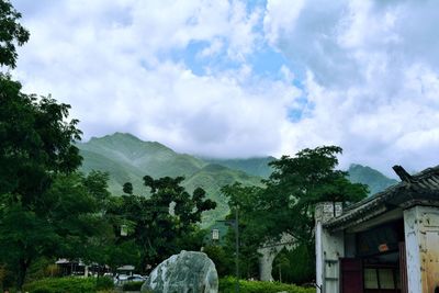 Scenic view of mountains against cloudy sky