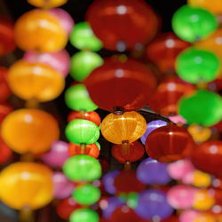 Full frame shot of multi colored lanterns hanging at night