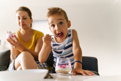 Portrait of a boy sitting on table