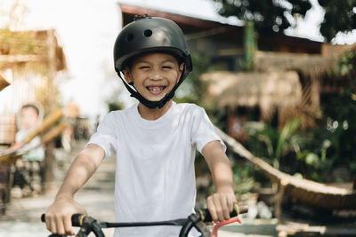 Portrait of boy riding bicycle