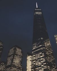 Low angle view of illuminated city at night