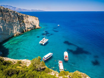 High angle view of sailboats on sea against sky