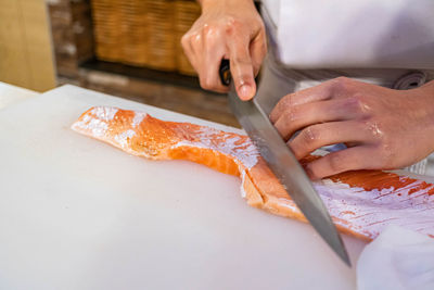 Midsection of man preparing food