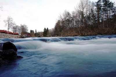 Scenic view of landscape against sky during winter