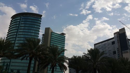 Low angle view of building against cloudy sky