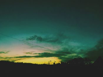 Low angle view of silhouette landscape against sky during sunset