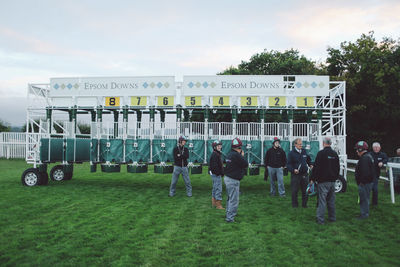 Group of people standing on grass