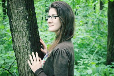 Portrait of young woman in forest