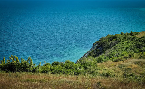 Scenic view of sea against blue sky