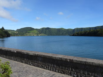 Scenic view of lake against blue sky