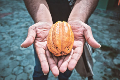 Cacao. close-up of man holding ice cream