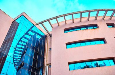 Low angle view of building against blue sky