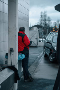 Man on street in city during winter