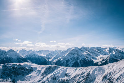 Scenic view of mountains against blue sky