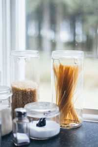 Close-up of raw food in jar on table