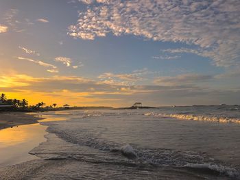 View of beach against cloudy sky