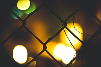 Low angle view of illuminated lamp post at night