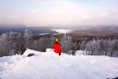 Man standing on snow covered landscape