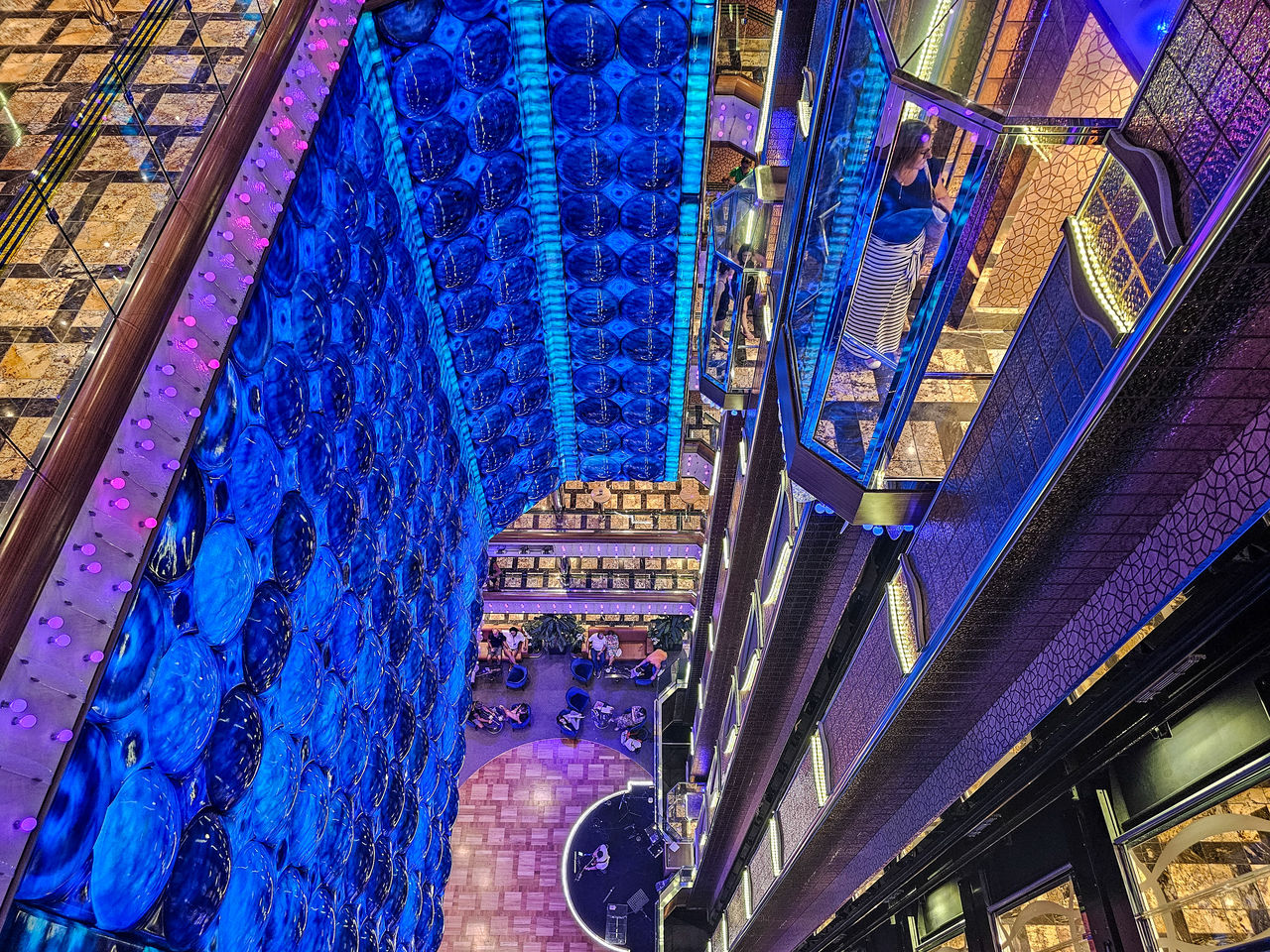 architecture, built structure, blue, building exterior, metropolis, no people, low angle view, urban area, city, building, multi colored, night, cityscape, illuminated, travel destinations, pattern, outdoors, ceiling