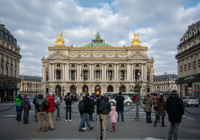 Tourists in front of building