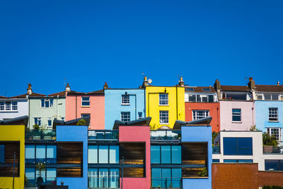 Low angle view of buildings against blue sky