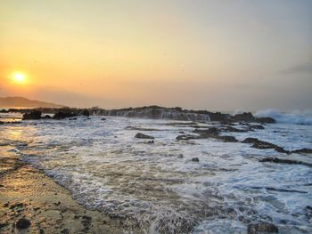 Scenic view of sea against sky during sunset