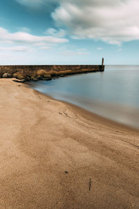 Scenic view of beach against sky