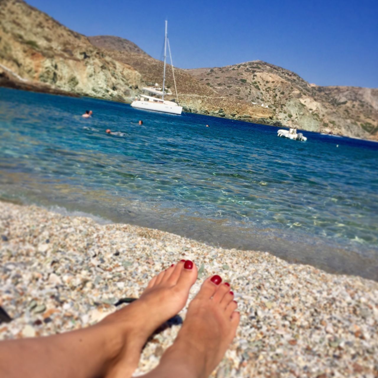 sea, water, beach, barefoot, low section, sand, human leg, one person, human foot, day, outdoors, nature, scenics, human body part, vacations, real people, tranquil scene, women, summer, blue, nail polish, sky, beauty in nature, horizon over water, clear sky, close-up, one woman only, adult, people