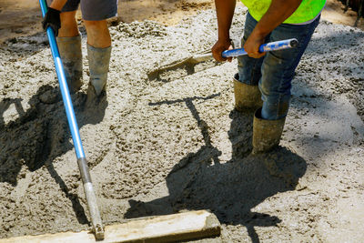 Low section of people working at construction site