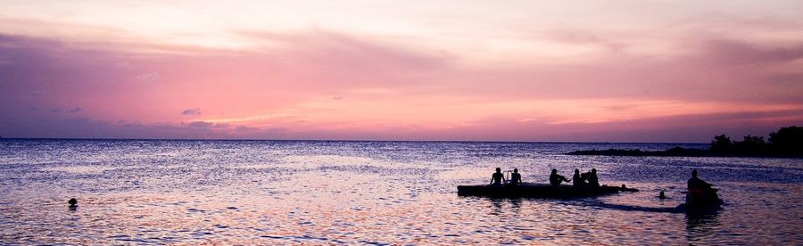 Scenic view of sea at sunset