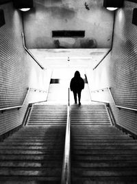 Full length of woman walking on wall