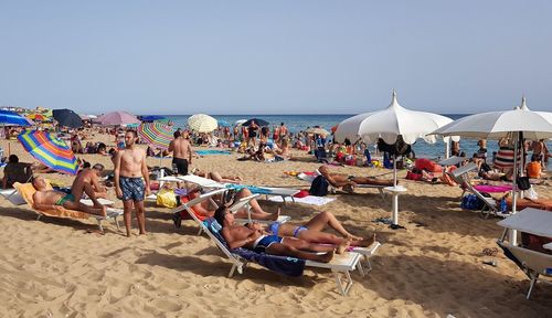 People relaxing on beach