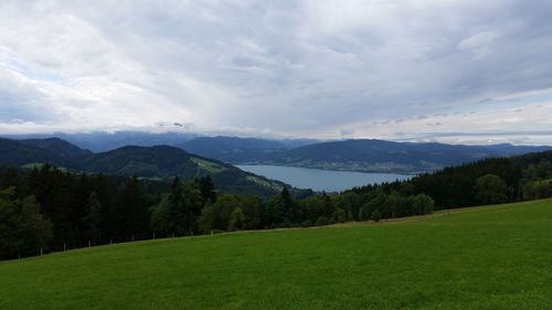 Scenic view of mountains against cloudy sky