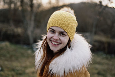 Portrait of young woman standing outdoors