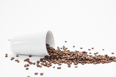 Close-up of coffee beans against white background