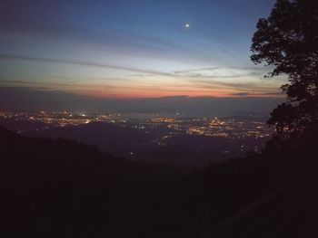 Silhouette of mountains against sky at sunset