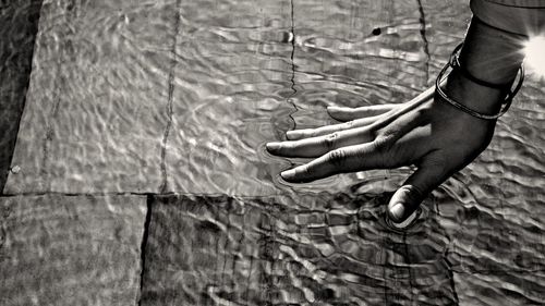 Hand of woman in water