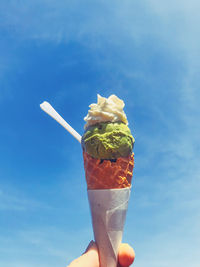 Midsection of person holding ice cream