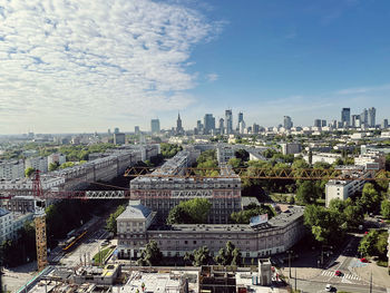 High angle view of city buildings against sky