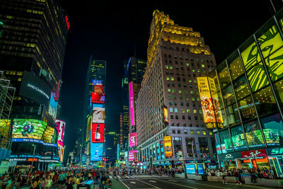 Illuminated modern buildings in city at night