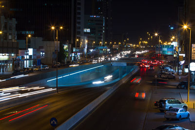 Traffic light trails on road at night