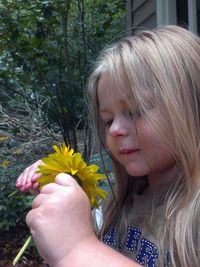 Close-up of woman holding flower