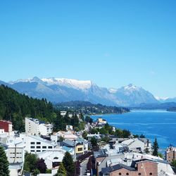 Scenic view of mountains against blue sky